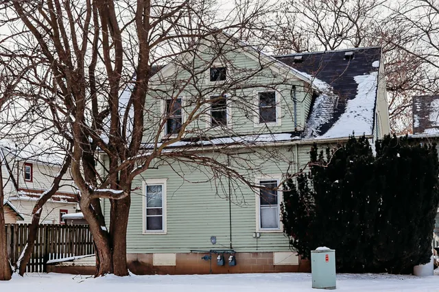 a front view of a house with garage