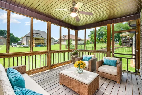 a balcony with furniture and a potted plant