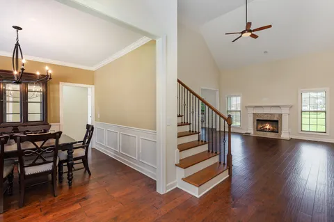 a view of a livingroom with furniture and hardwood floor