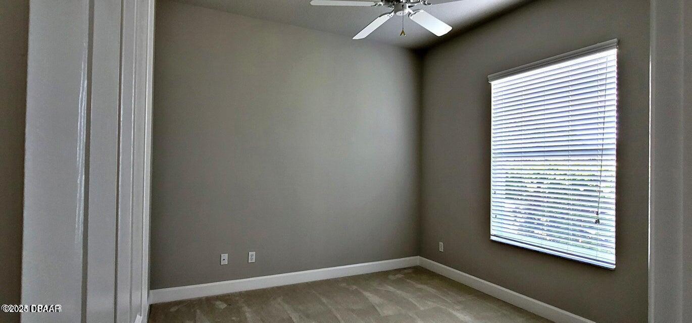 1070 Hampstead Lane Ormond Beach, FL 32174 - Photo 10 of 18 a view of a room that has a window in it
