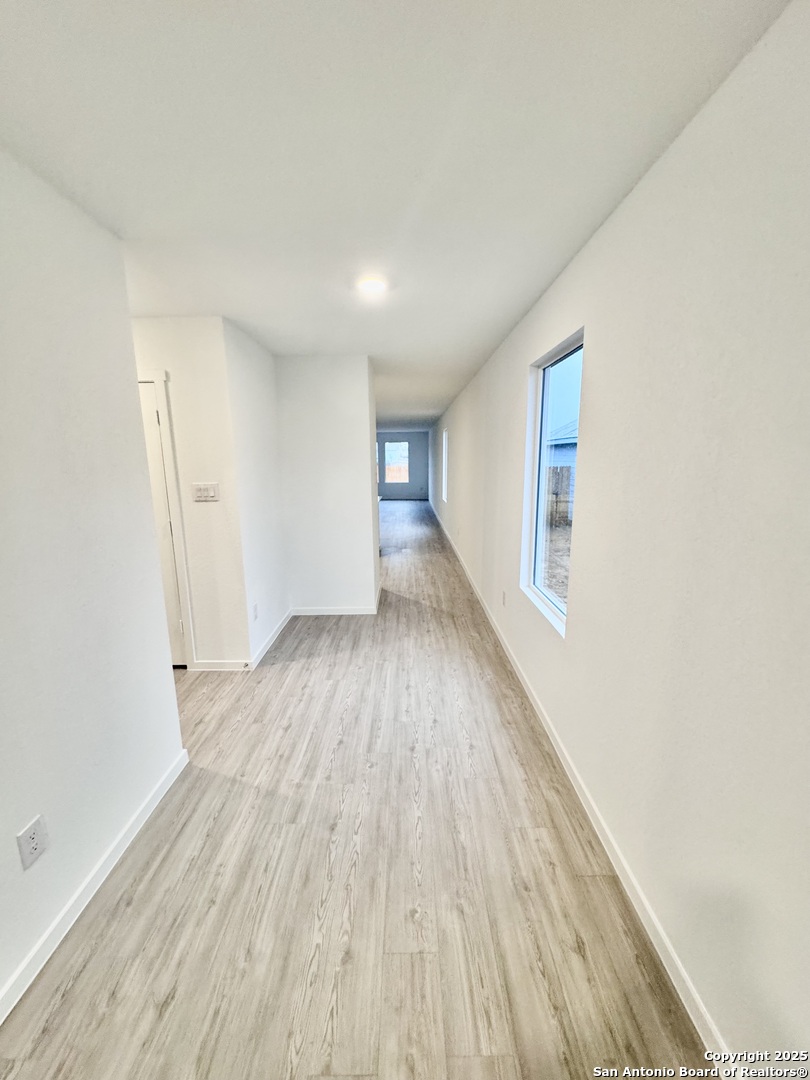 5151 Yancy Creek Converse, TX 78109 - Photo 3 of 17 wooden floor in an empty room with a window