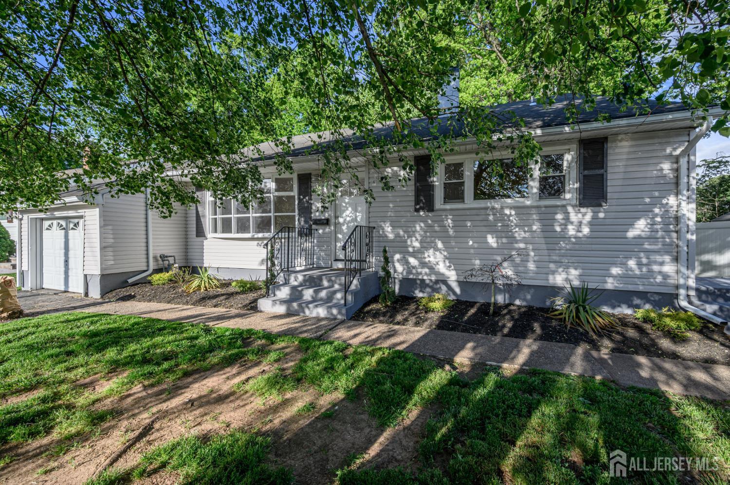 56 Drake Place Colonia, NJ 07067 - Photo 1 of 31 a view of back yard of the house
