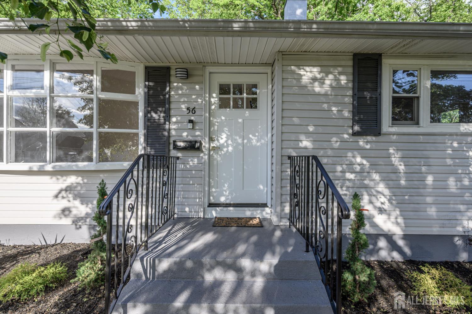 56 Drake Place Colonia, NJ 07067 - Photo 2 of 31 a view of a house with a porch