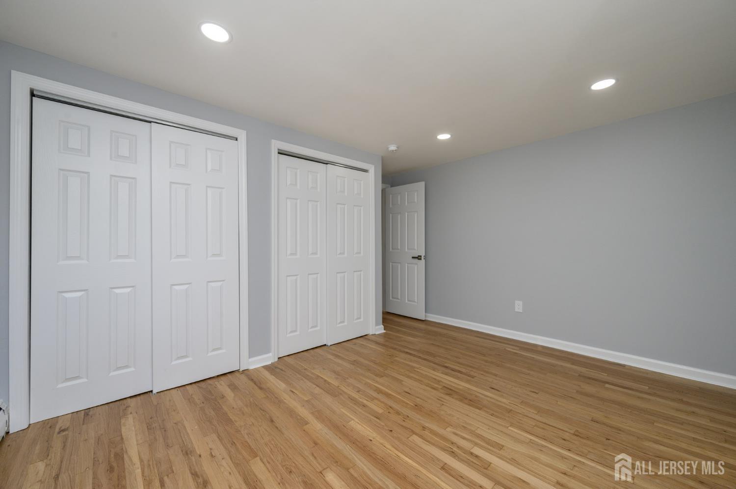 56 Drake Place Colonia, NJ 07067 - Photo 23 of 31 a view of an empty room with wooden floor