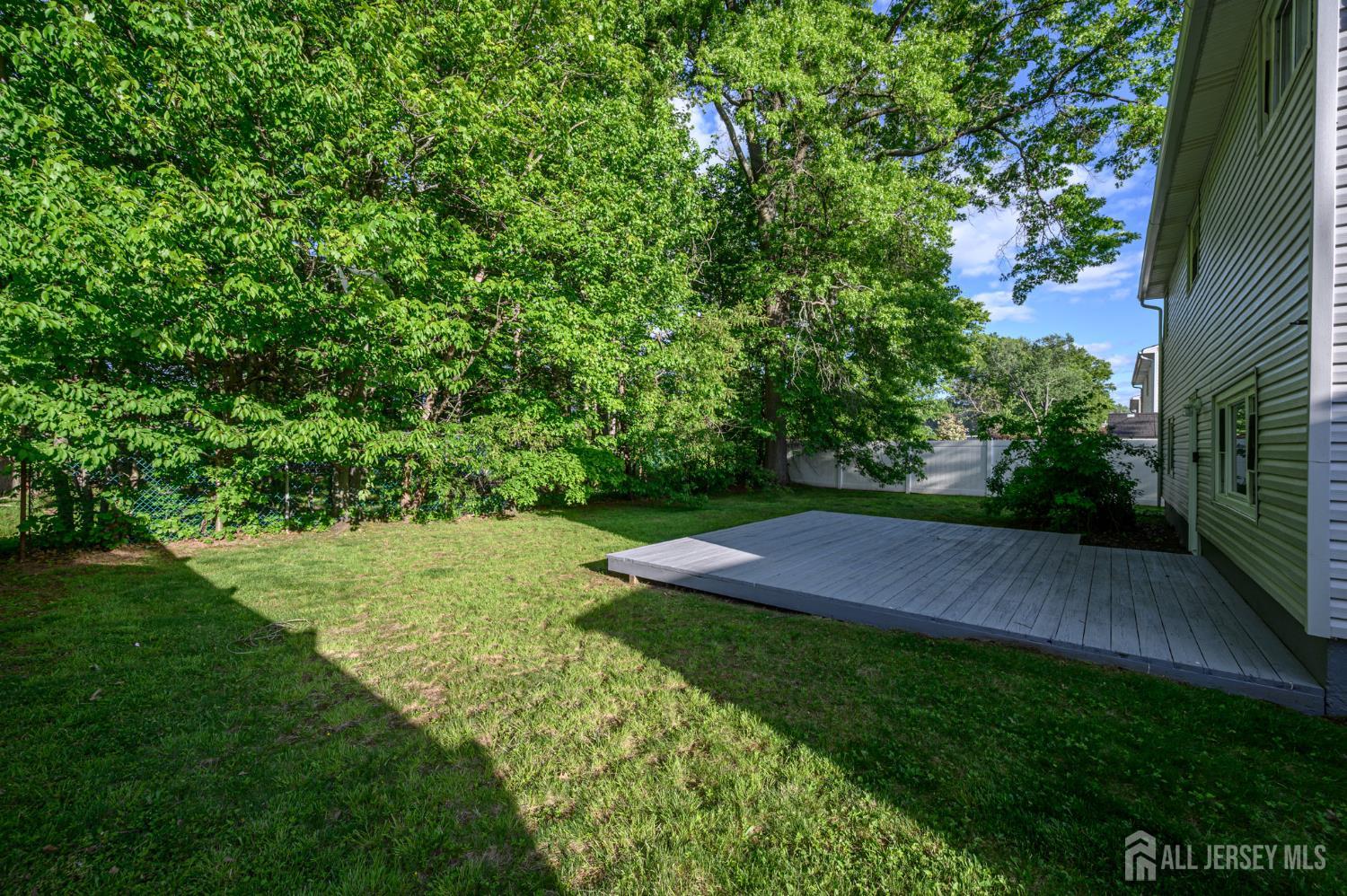 56 Drake Place Colonia, NJ 07067 - Photo 24 of 31 a view of yard with green space