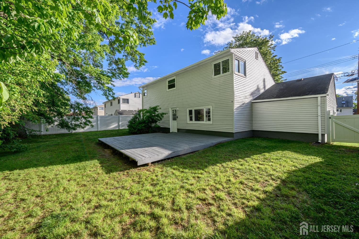 56 Drake Place Colonia, NJ 07067 - Photo 25 of 31 a front view of house with a garden