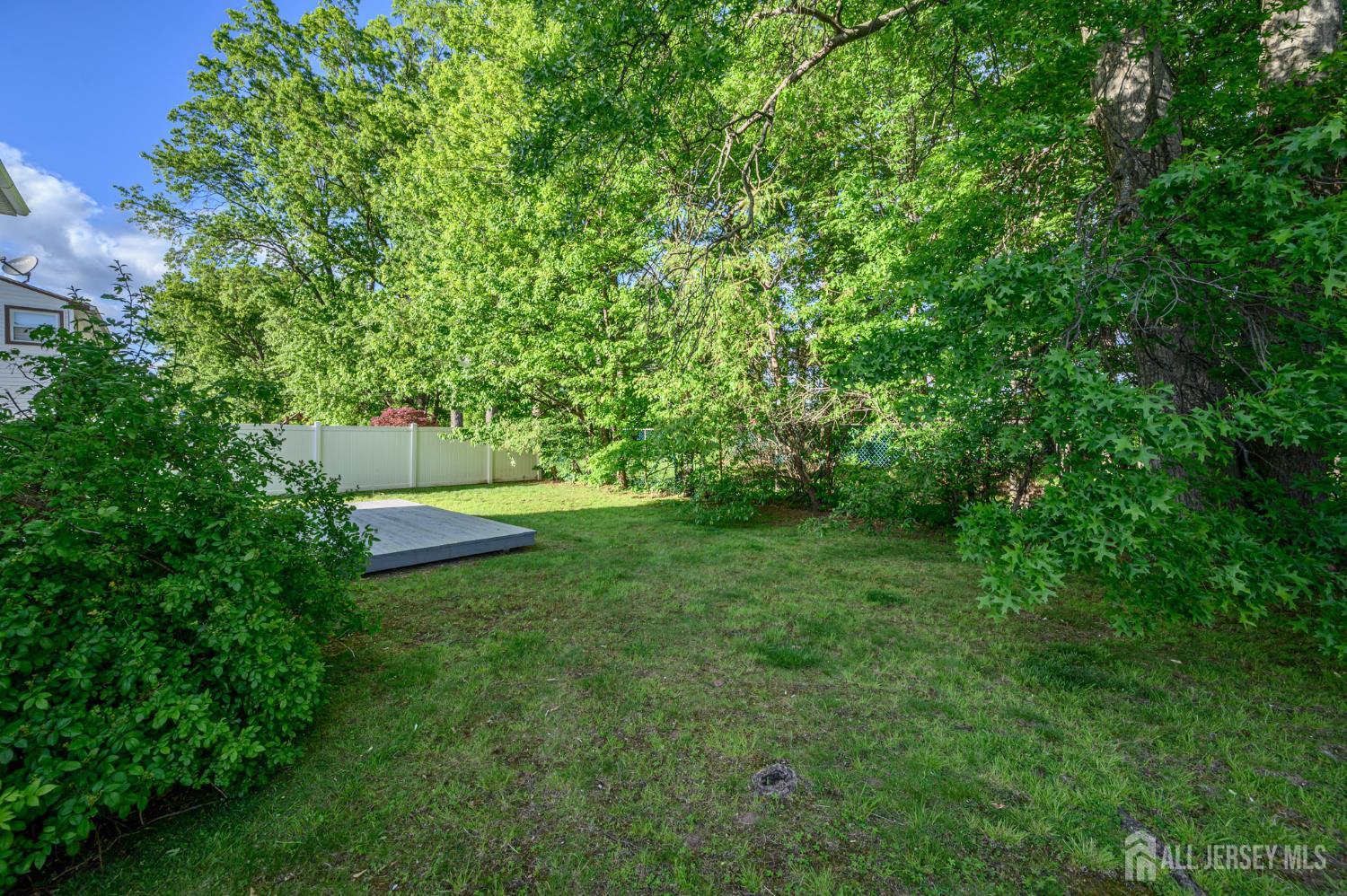 56 Drake Place Colonia, NJ 07067 - Photo 27 of 31 a view of a garden with a tree