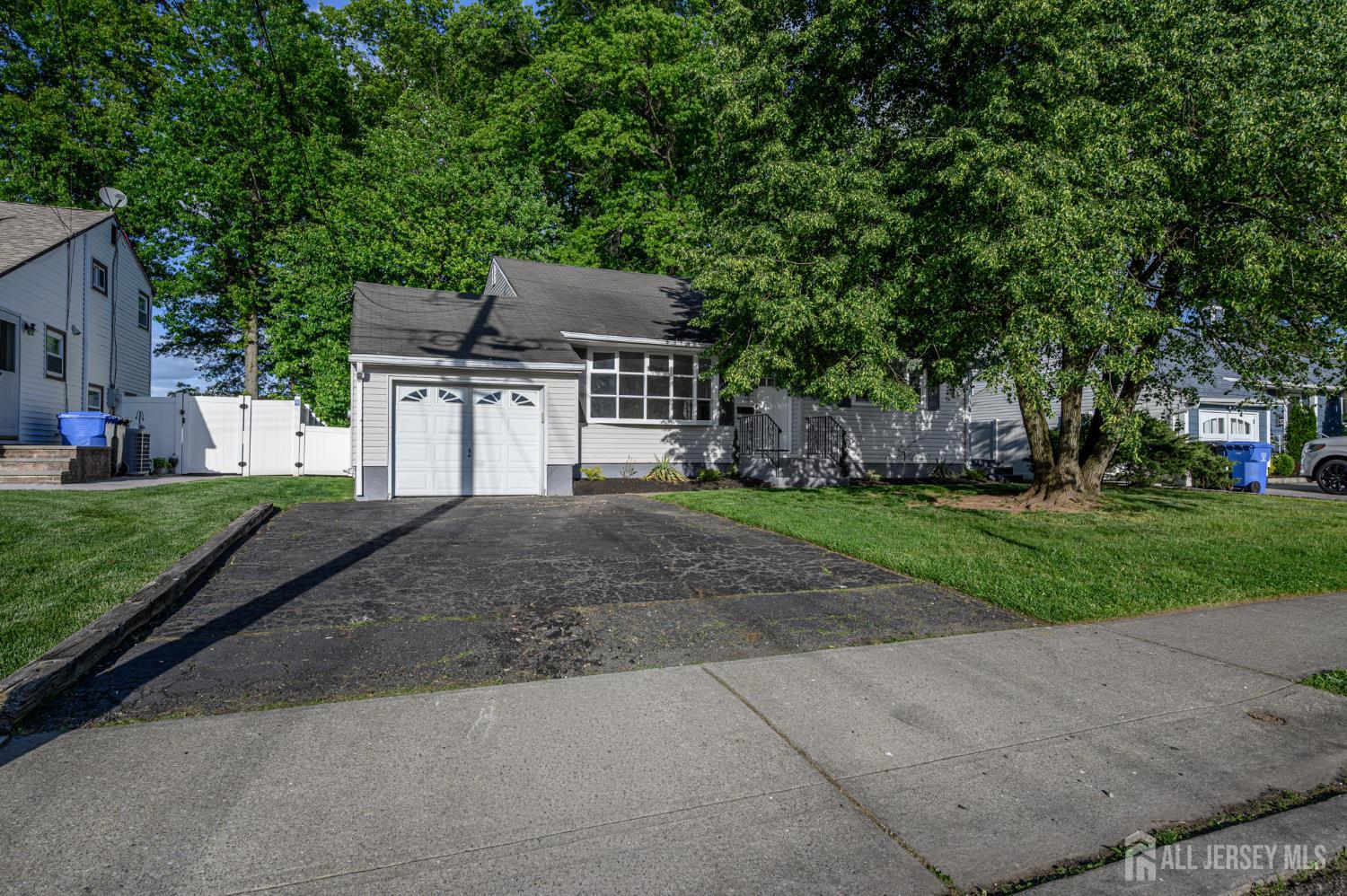 56 Drake Place Colonia, NJ 07067 - Photo 28 of 31 a front view of a house with a yard