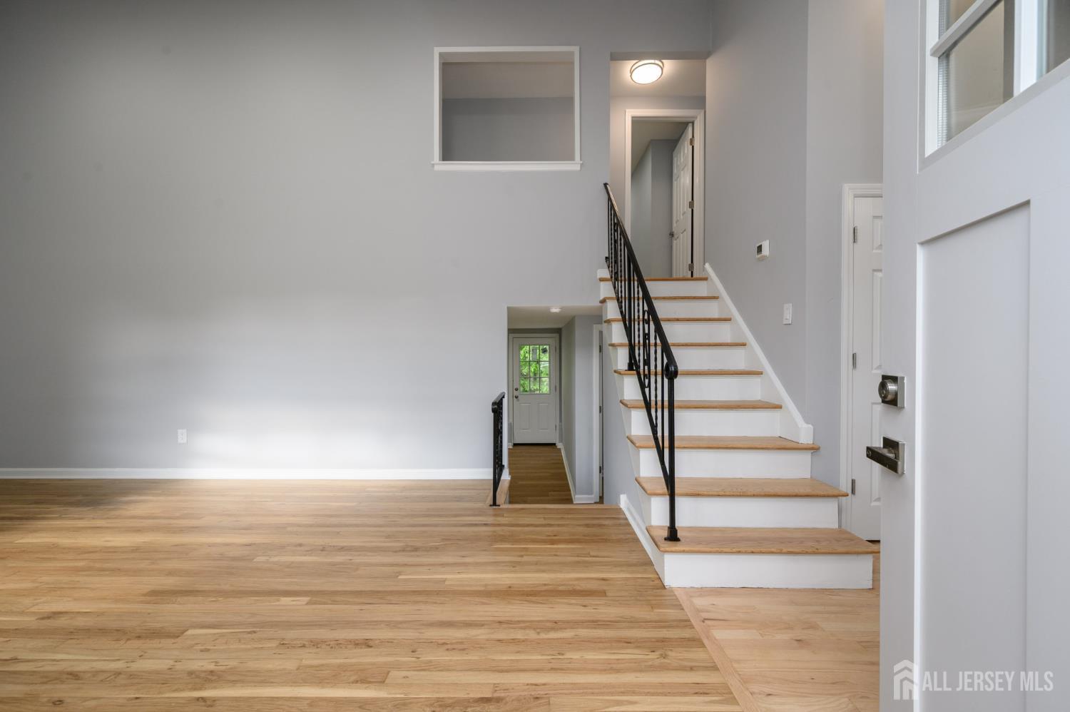 56 Drake Place Colonia, NJ 07067 - Photo 3 of 31 a view of a room with wooden floor and stairs