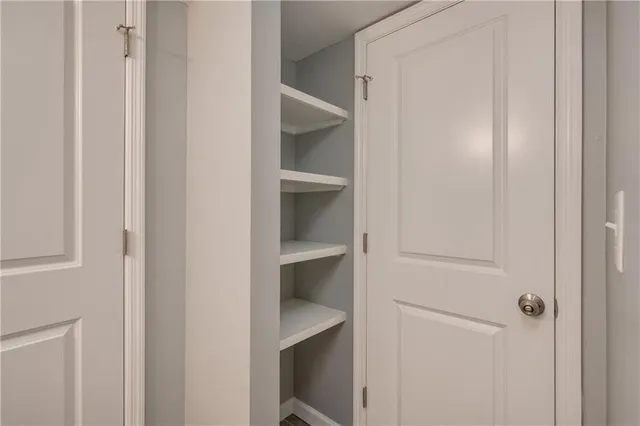 a view of an empty walk in closet
