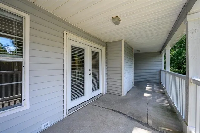 a view of house with porch and wooden floor