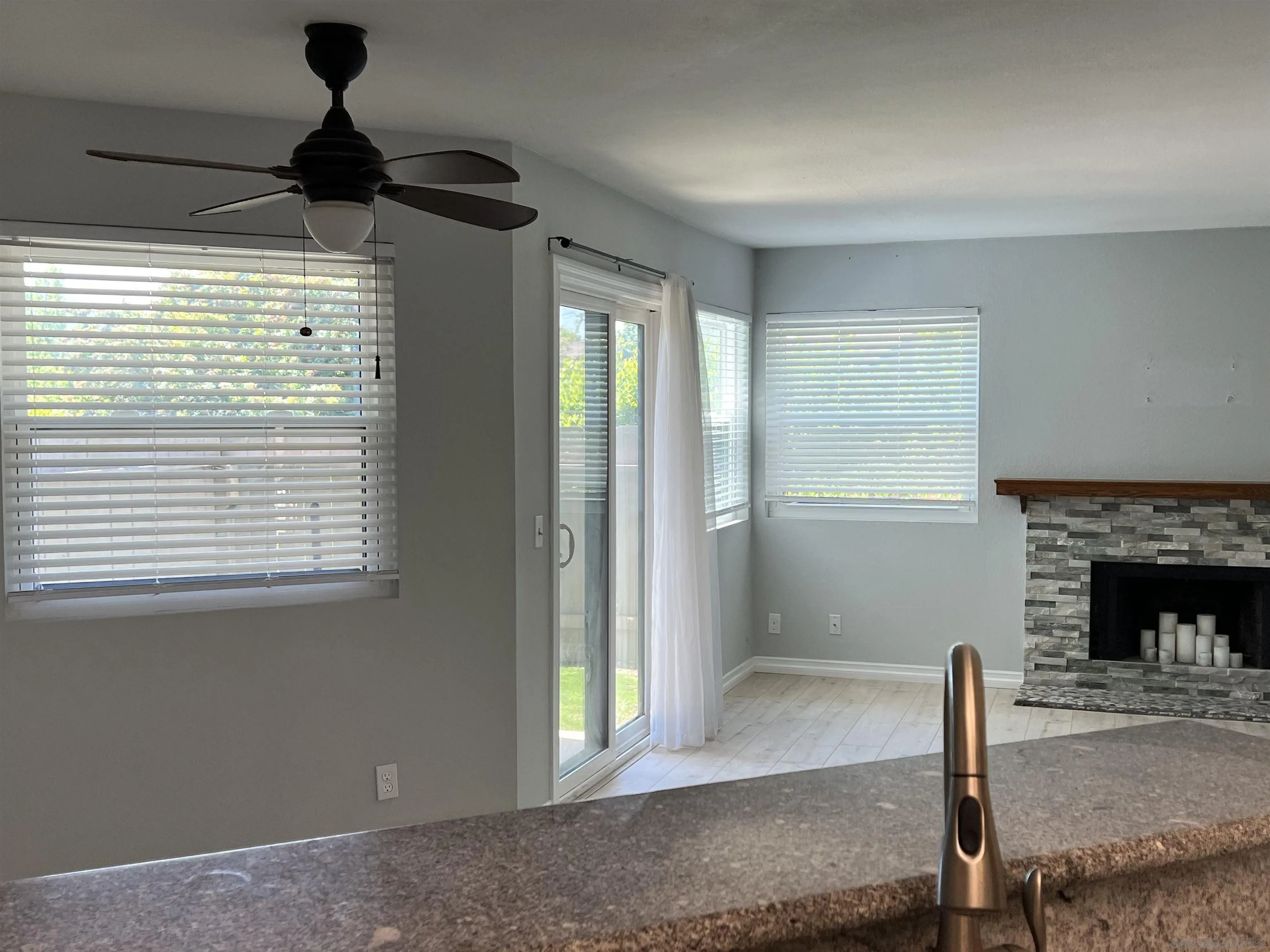 3043 Chipwood Court Spring Valley, CA 91978 - Photo 16 of 38 a living room with furniture and a fireplace