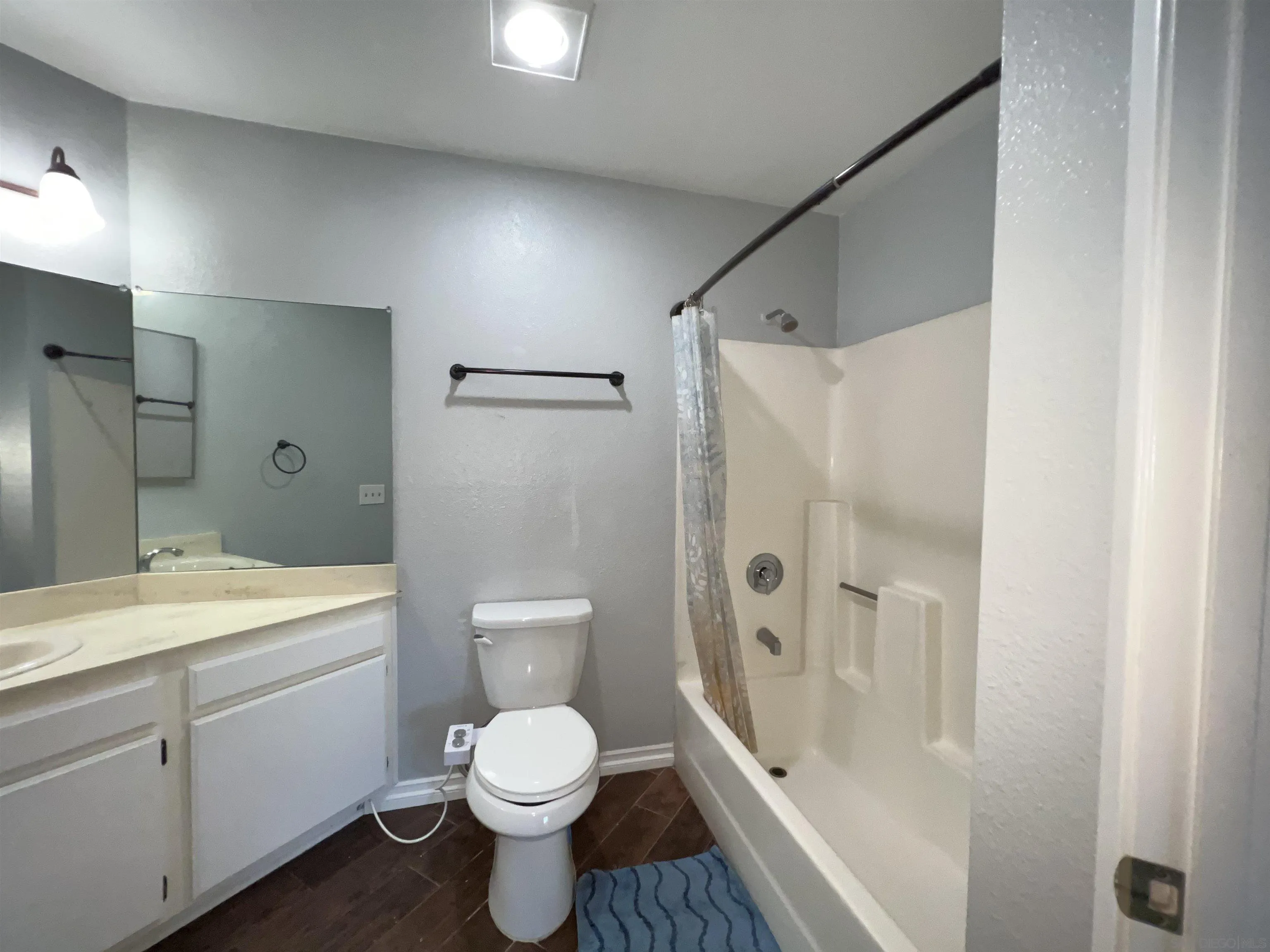 3043 Chipwood Court Spring Valley, CA 91978 - Photo 25 of 38 a bathroom with a sink a toilet and shower
