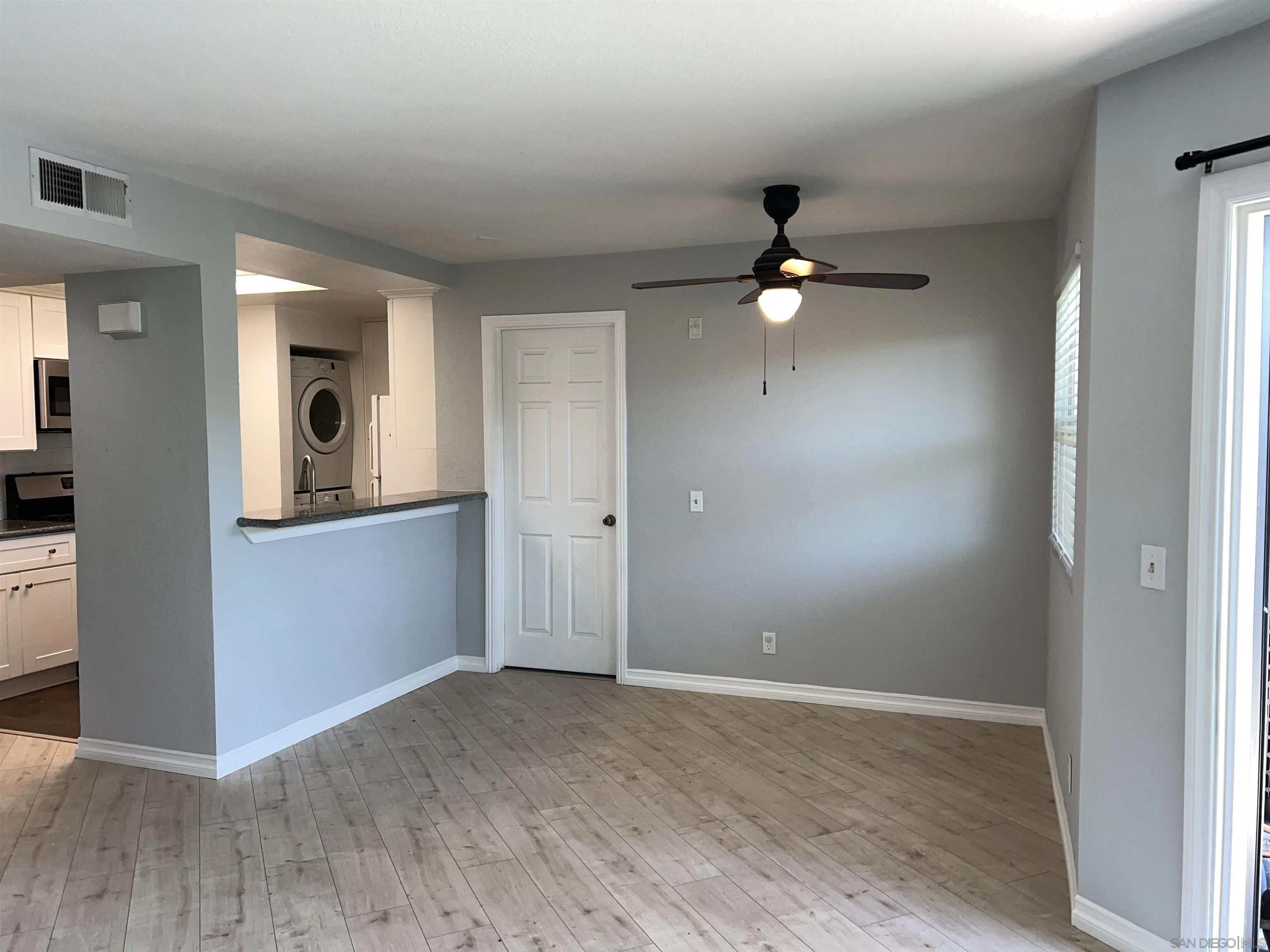 3043 Chipwood Court Spring Valley, CA 91978 - Photo 7 of 38 wooden floor in an empty room with a window