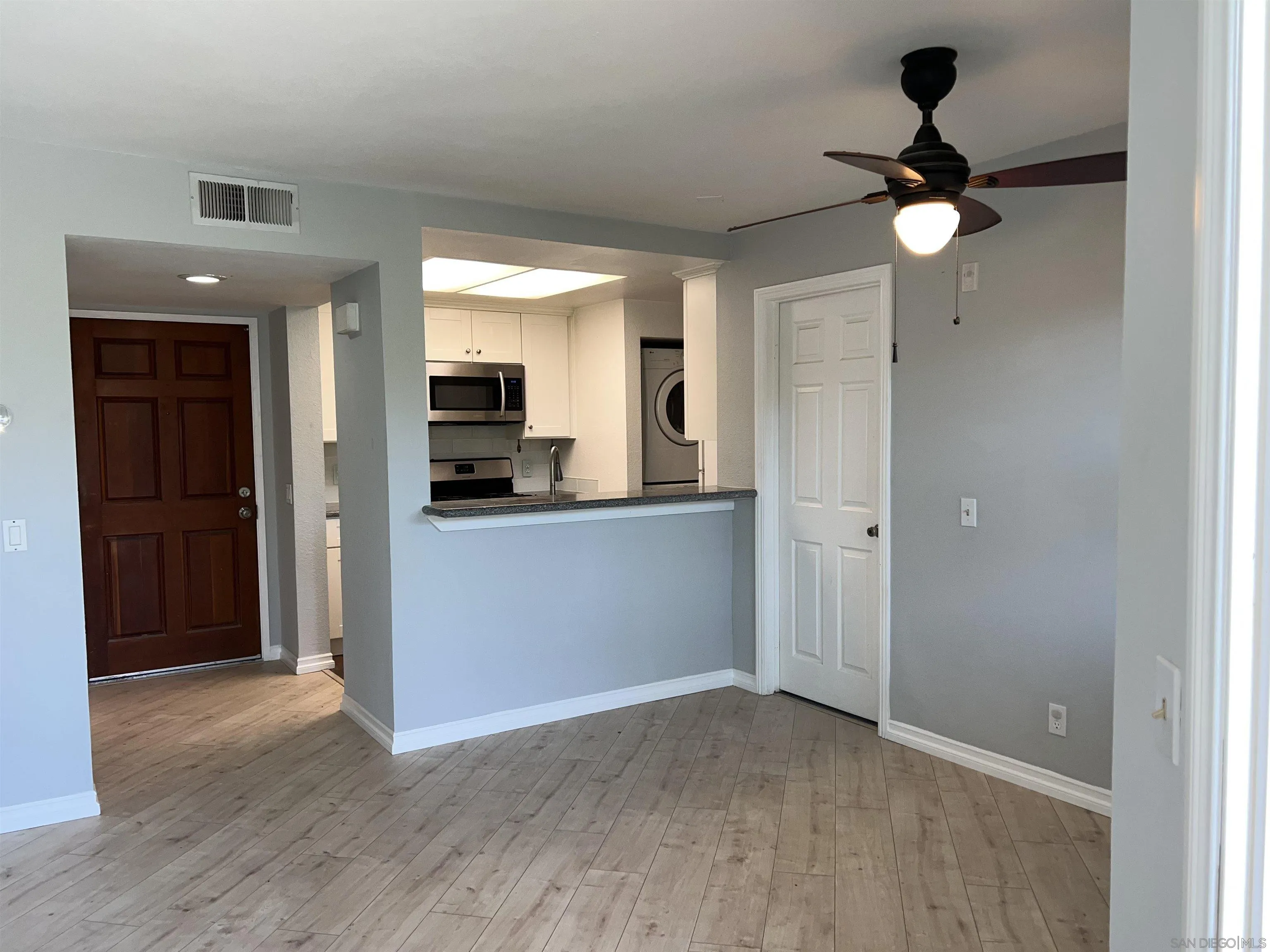 3043 Chipwood Court Spring Valley, CA 91978 - Photo 8 of 38 a view of a kitchen with a sink and a refrigerator