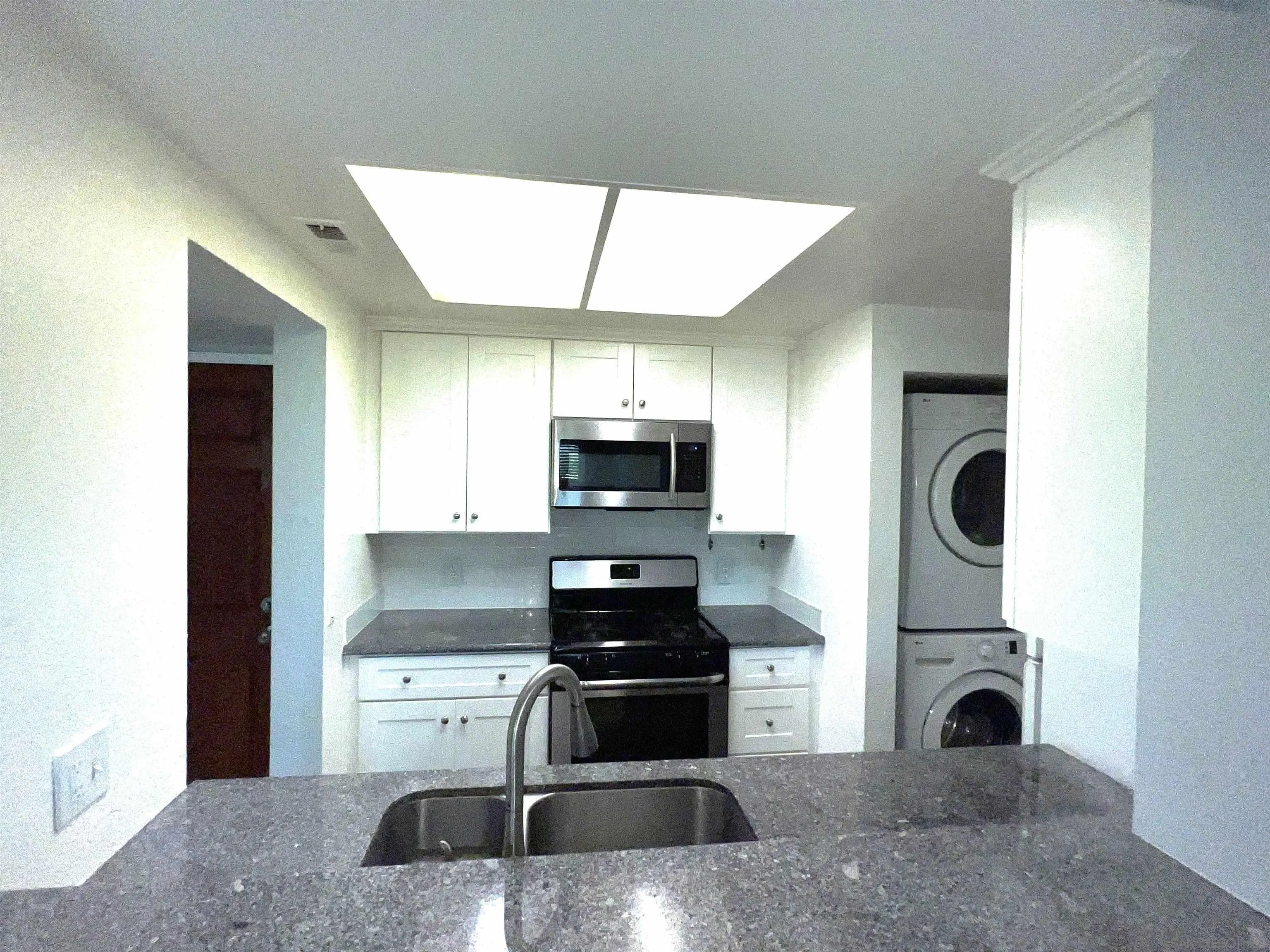 3043 Chipwood Court Spring Valley, CA 91978 - Photo 9 of 38 a kitchen with a stove and a refrigerator