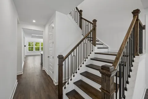 a view of an entryway with wooden floor