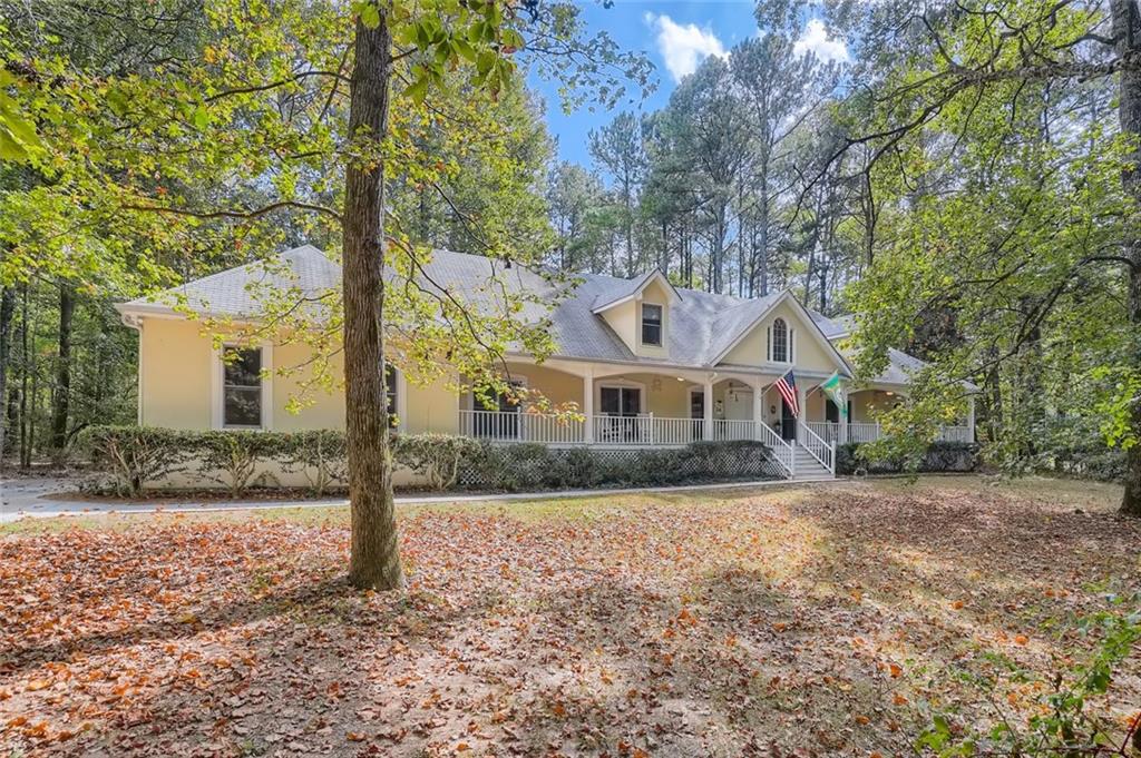 3504 Graycliff Road Snellville, GA 30039 - Photo 1 of 1 a front view of a house with a yard and garage