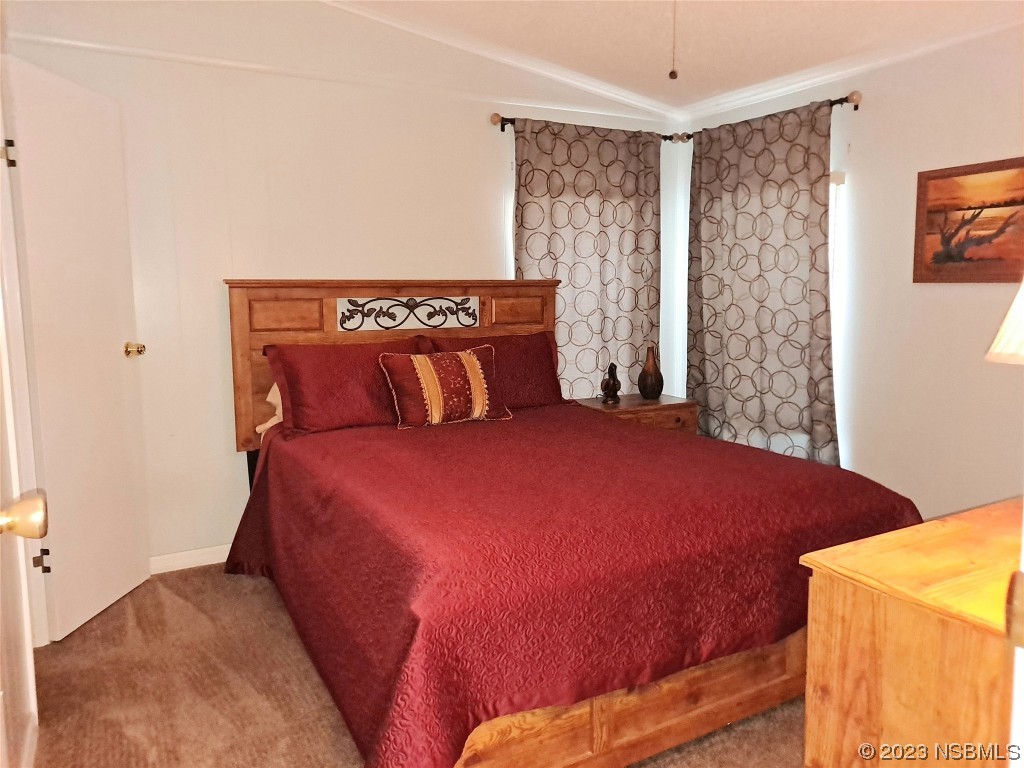 4330 Whiting Way Edgewater, FL 32141 - Photo 15 of 30 a bedroom with a bed and a window