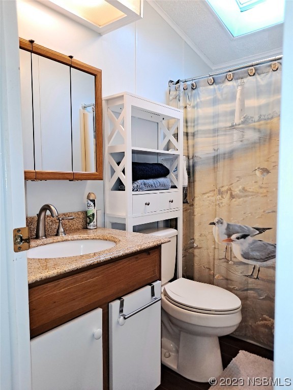 4330 Whiting Way Edgewater, FL 32141 - Photo 16 of 30 a bathroom with a sink toilet vanity and shower