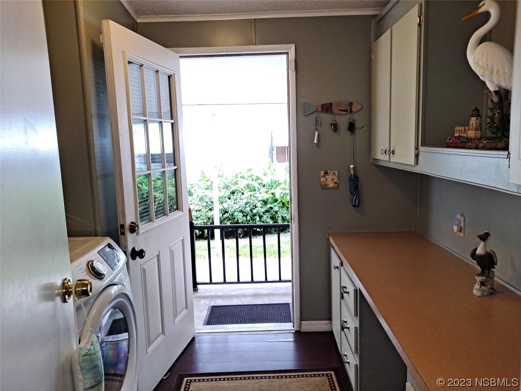 4330 Whiting Way Edgewater, FL 32141 - Photo 18 of 30 a view of a door with a sink and a window