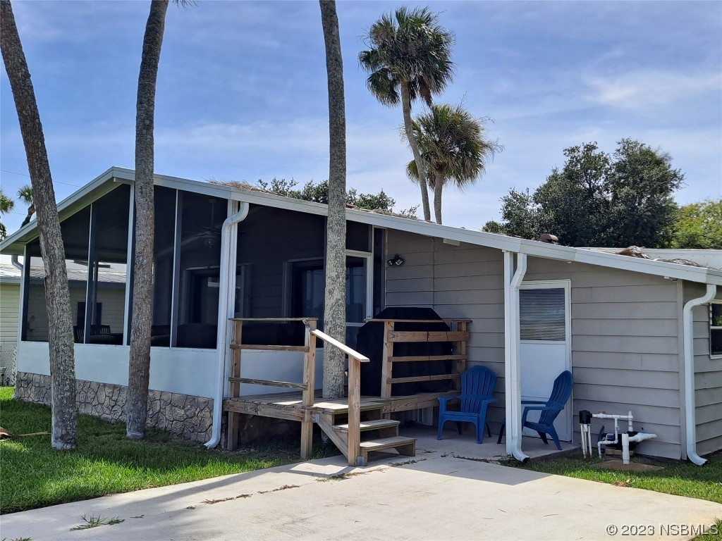 4330 Whiting Way Edgewater, FL 32141 - Photo 20 of 30 a front view of a house with garden