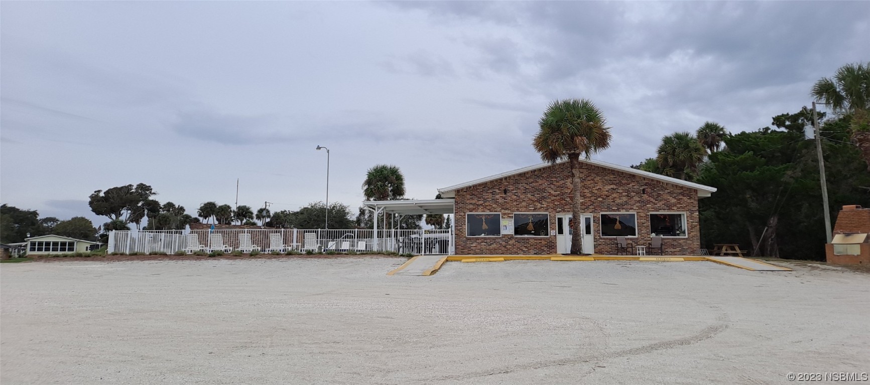 4330 Whiting Way Edgewater, FL 32141 - Photo 26 of 30 a view of a house with a yard and sitting area