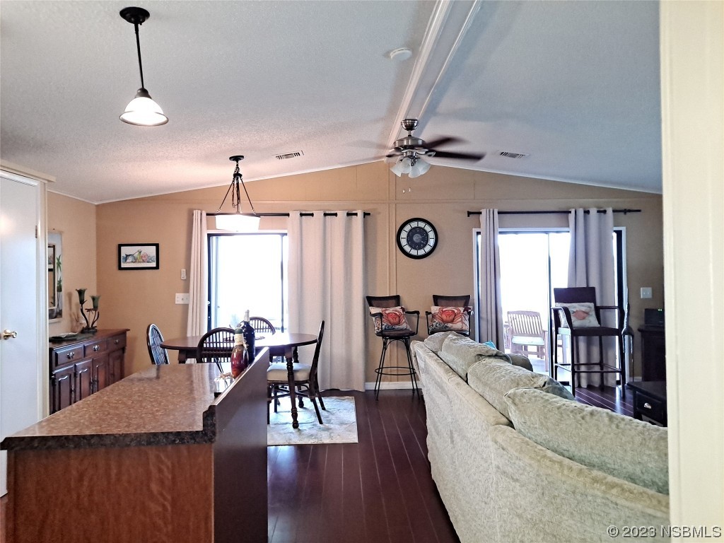 4330 Whiting Way Edgewater, FL 32141 - Photo 6 of 30 a living room with furniture and wooden floor