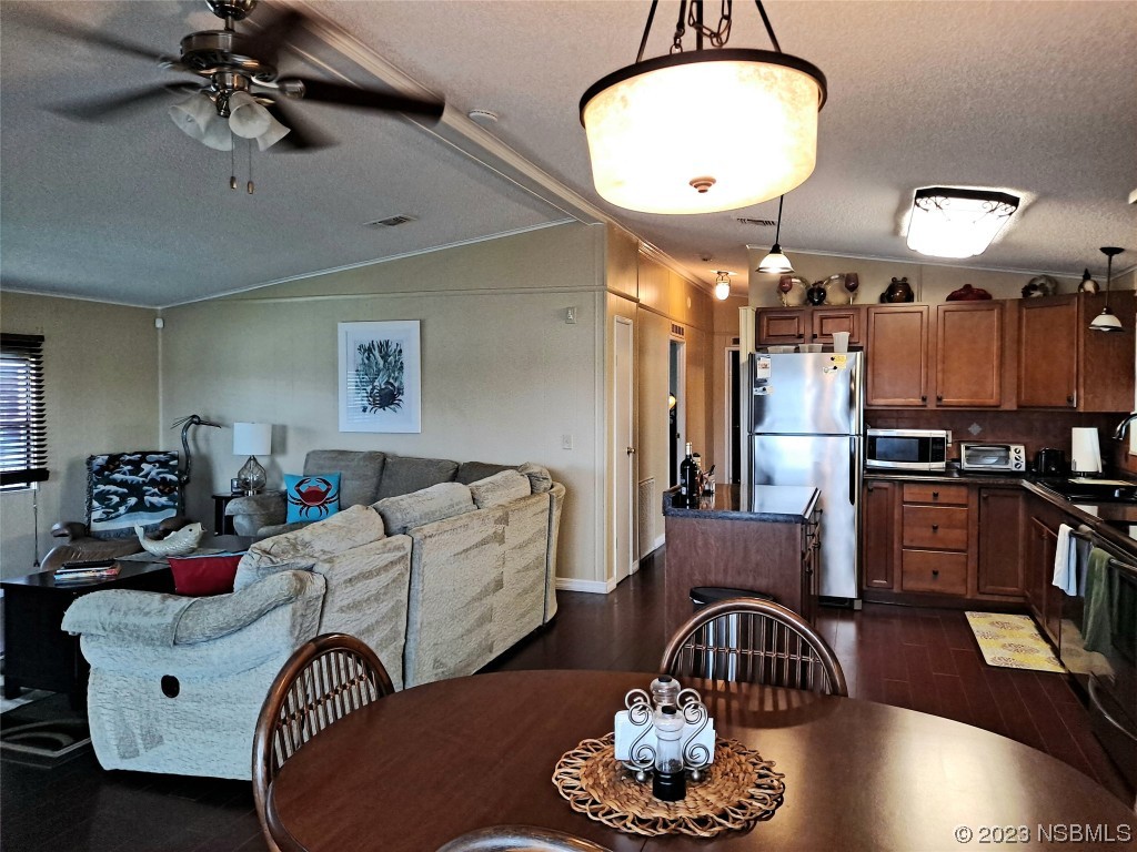 4330 Whiting Way Edgewater, FL 32141 - Photo 7 of 30 a living room with furniture and a chandelier