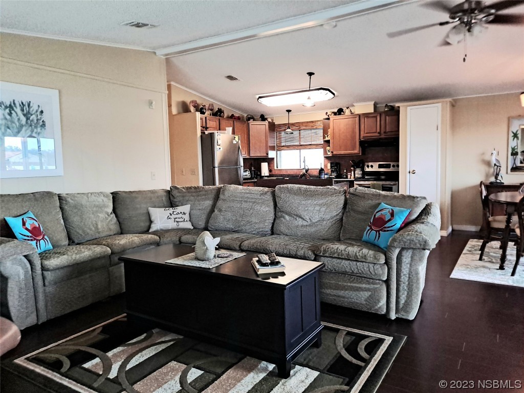 4330 Whiting Way Edgewater, FL 32141 - Photo 8 of 30 a living room with furniture and a chandelier
