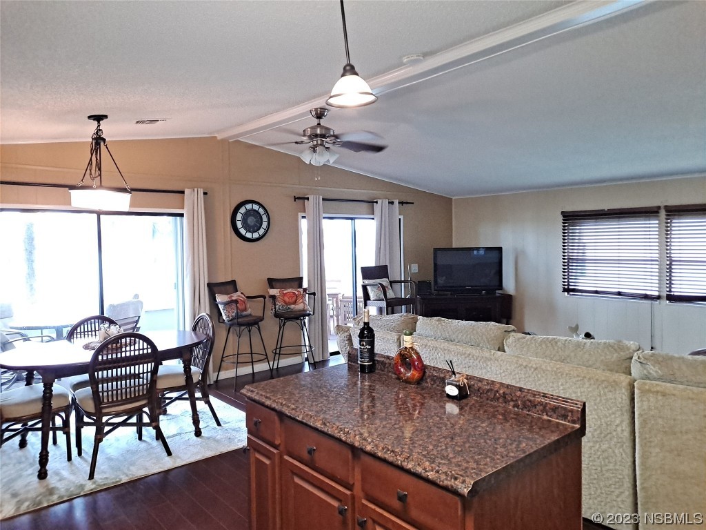 4330 Whiting Way Edgewater, FL 32141 - Photo 9 of 30 a view of a a dining room with furniture window and wooden floor