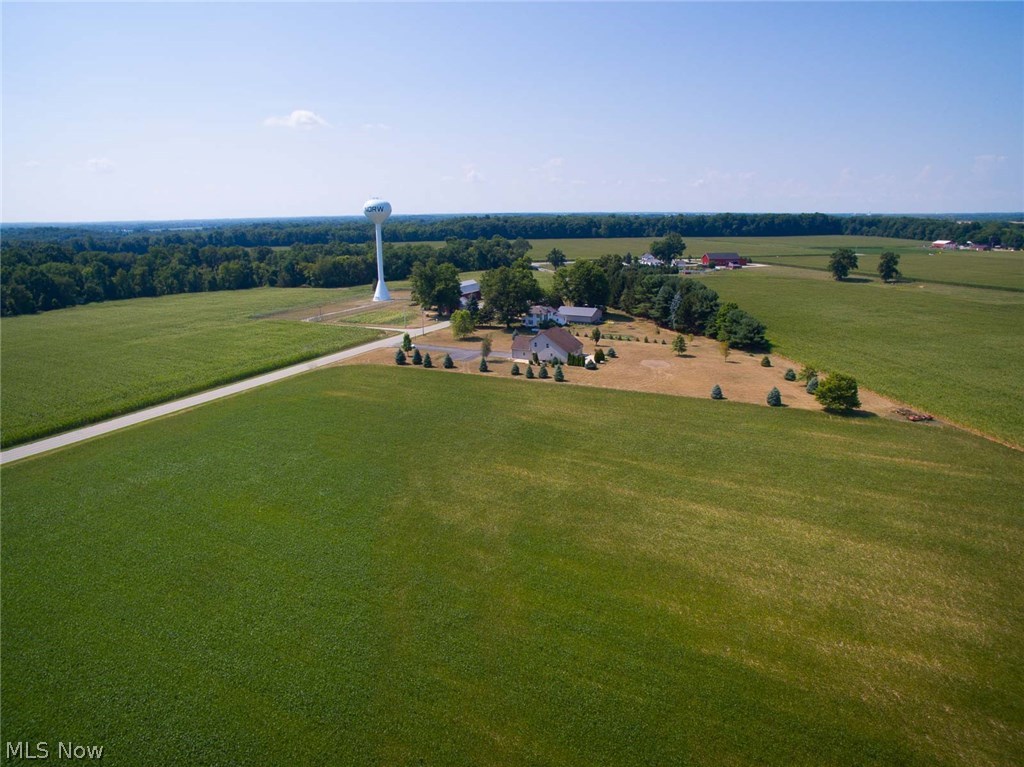 13719 Kelley Road Milan, OH 44846 - Photo 4 of 28 Soy beans are planted in the forefront of the property