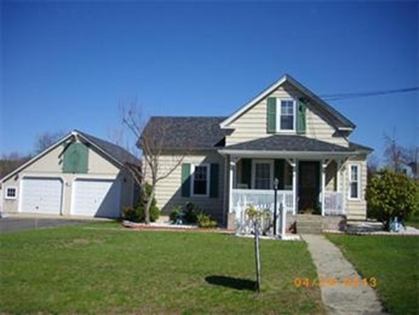 1 Robbins Road Monson, MA 01057 - Photo 1 of 3 a front view of a house with a yard