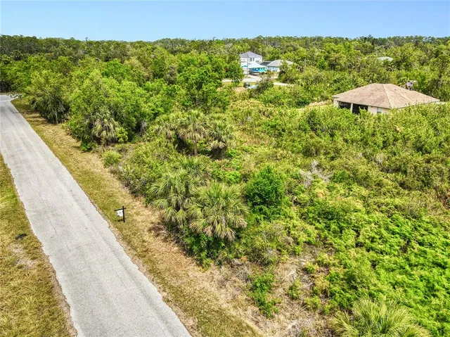a view of a lake with a house in the background
