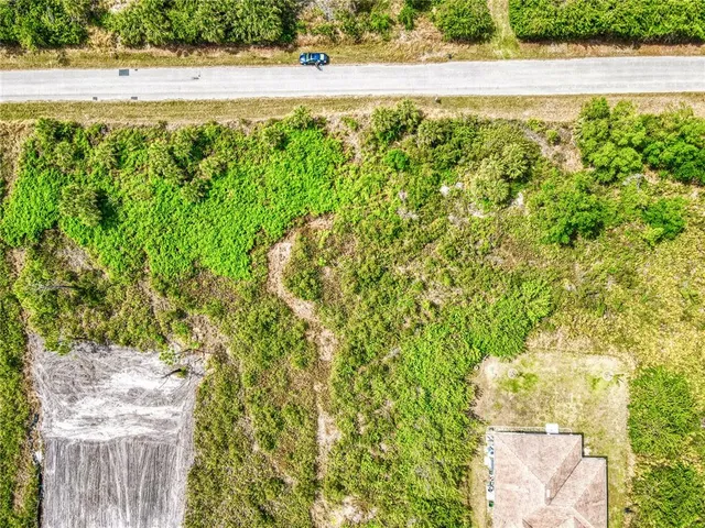 a view of a yard with an outdoor space