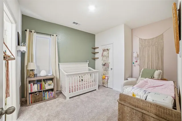 a bedroom with furniture and a book shelf