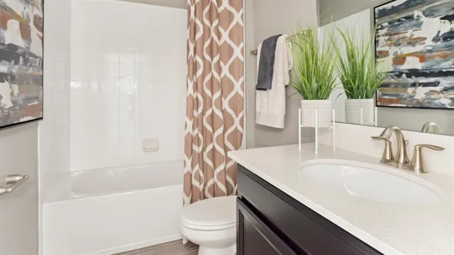 a bathroom with a sink a toilet and a bathtub