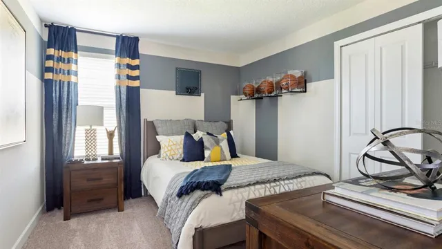 a bedroom with a bed and cabinets