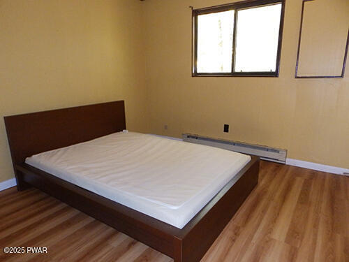 105 Roundhill Road Dingmans Ferry, PA 18328 - Photo 7 of 18 a close up of a bed in a room