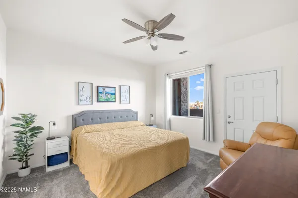 a bedroom with a bed and a couch