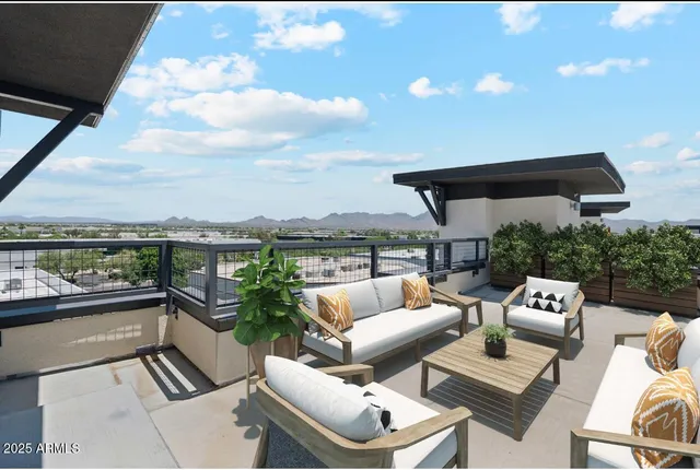 a view of balcony with couch and chairs