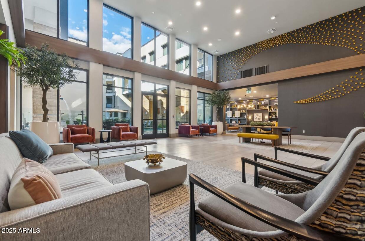 15501 North Dial Boulevard, Unit A1 Scottsdale, AZ 85260 - Photo 13 of 24 a living room with furniture and a floor to ceiling window