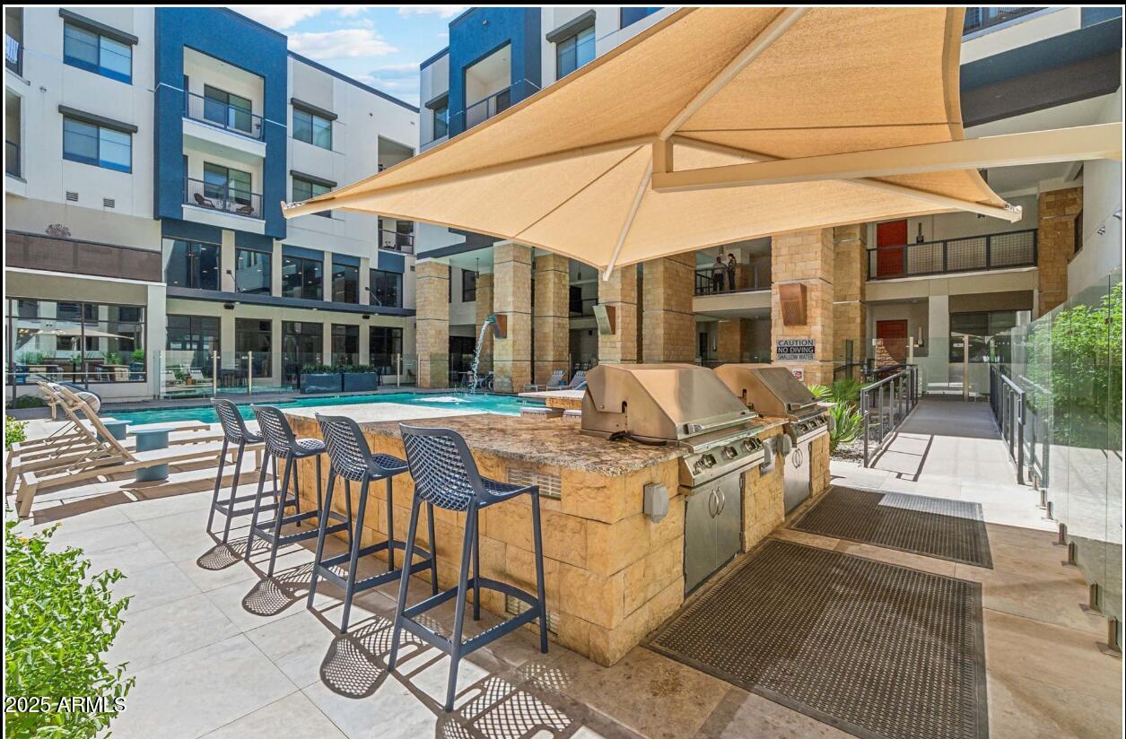 15501 North Dial Boulevard, Unit A1 Scottsdale, AZ 85260 - Photo 18 of 24 a view of a building with sitting area and furniture