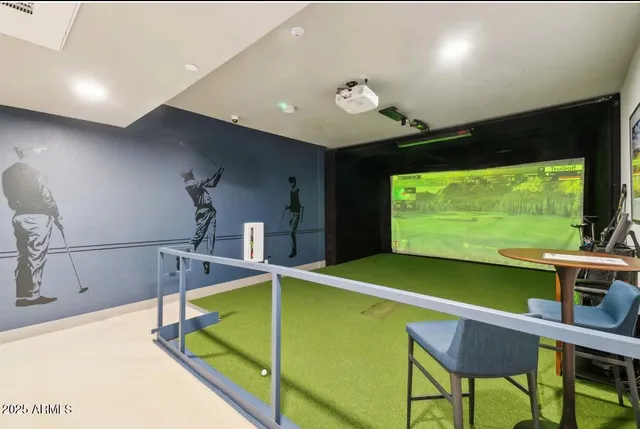 a room with pool table and large windows