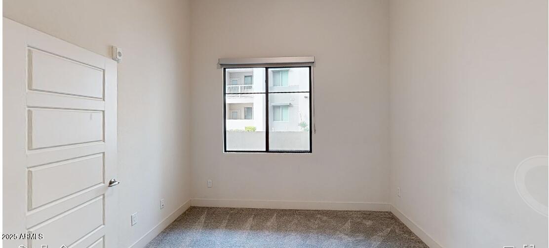 15501 North Dial Boulevard, Unit A1 Scottsdale, AZ 85260 - Photo 3 of 24 an empty room with a window