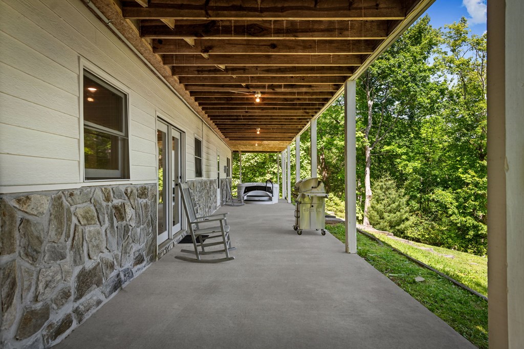 760 River Bend Lane Blue Ridge, GA 30513 - Photo 78 of 101 a view of a porch with wooden stairs and bench