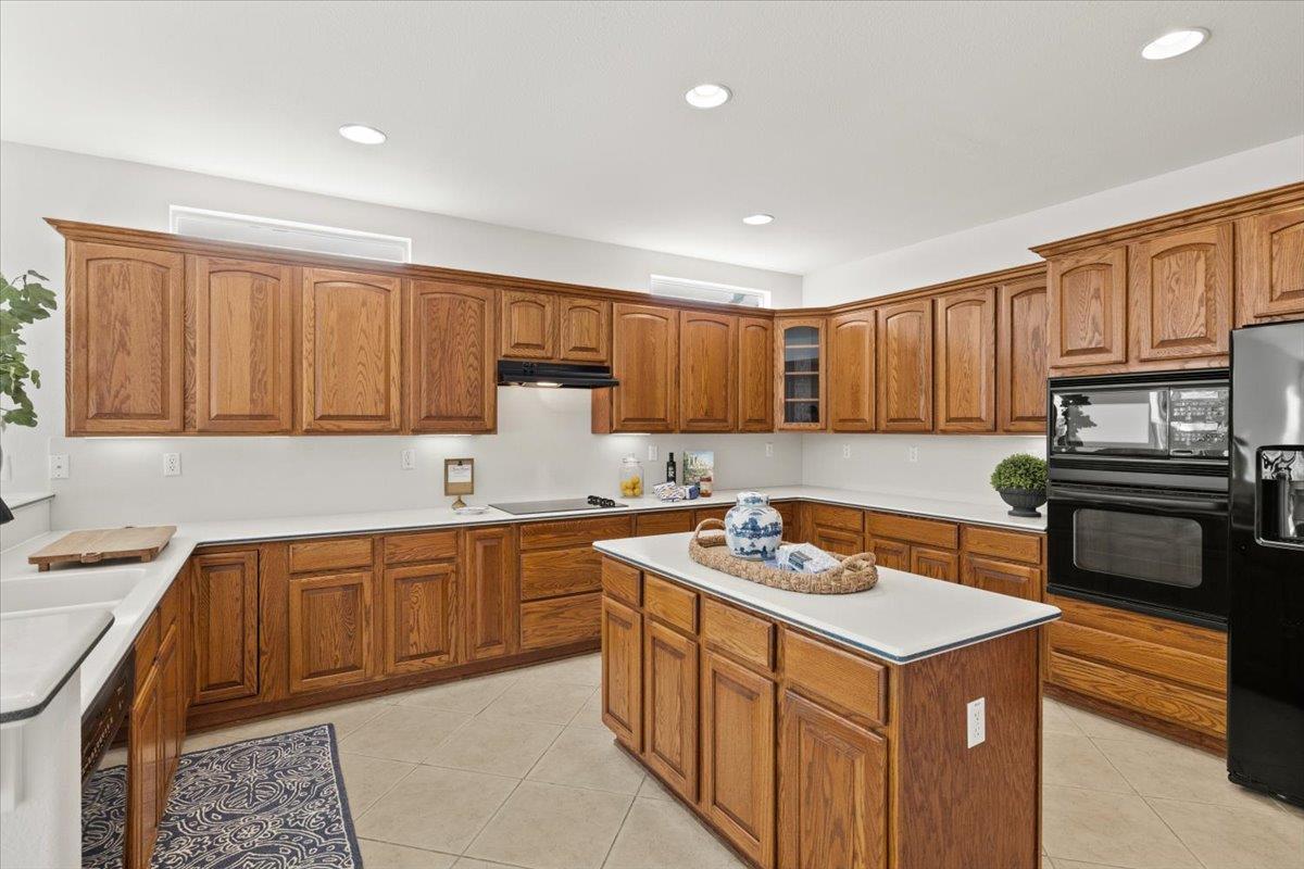 851 Rocky Ridge Lane Lincoln, CA 95648 - Photo 11 of 31 a kitchen with granite countertop stainless steel appliances a stove sink and cabinets