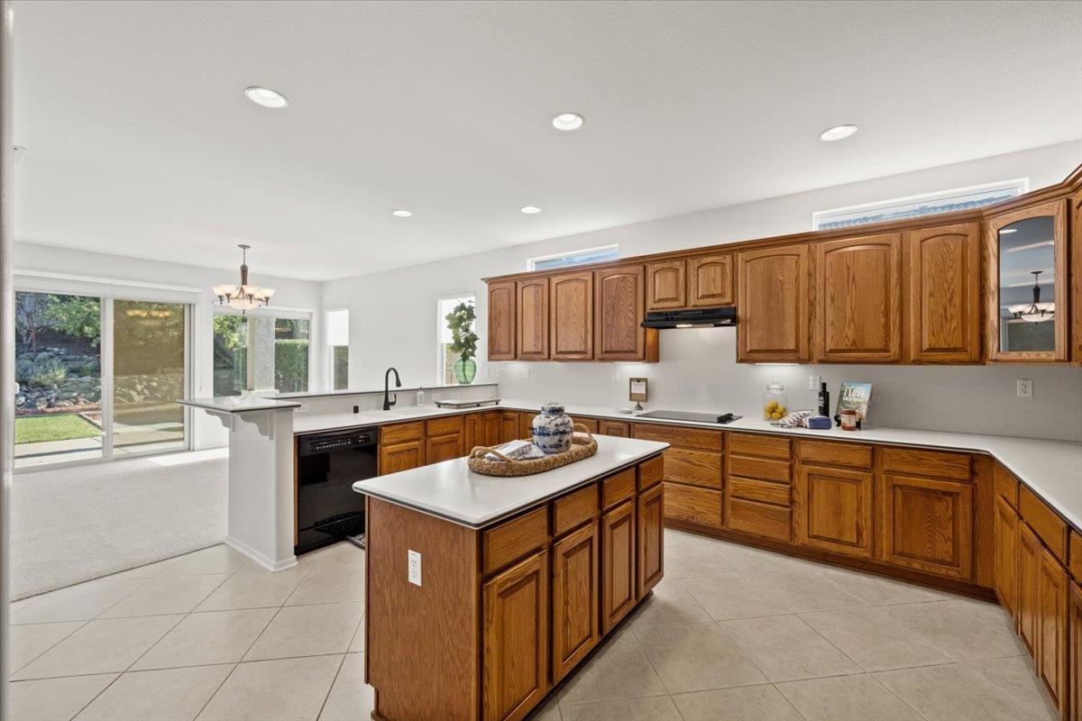 851 Rocky Ridge Lane Lincoln, CA 95648 - Photo 12 of 31 a kitchen with stainless steel appliances granite countertop a stove a sink dishwasher and a refrigerator