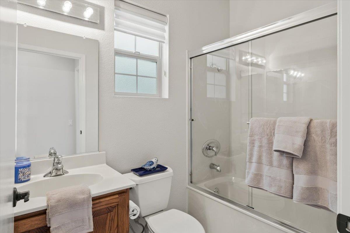 851 Rocky Ridge Lane Lincoln, CA 95648 - Photo 24 of 31 a bathroom with a granite countertop sink toilet a mirror and shower