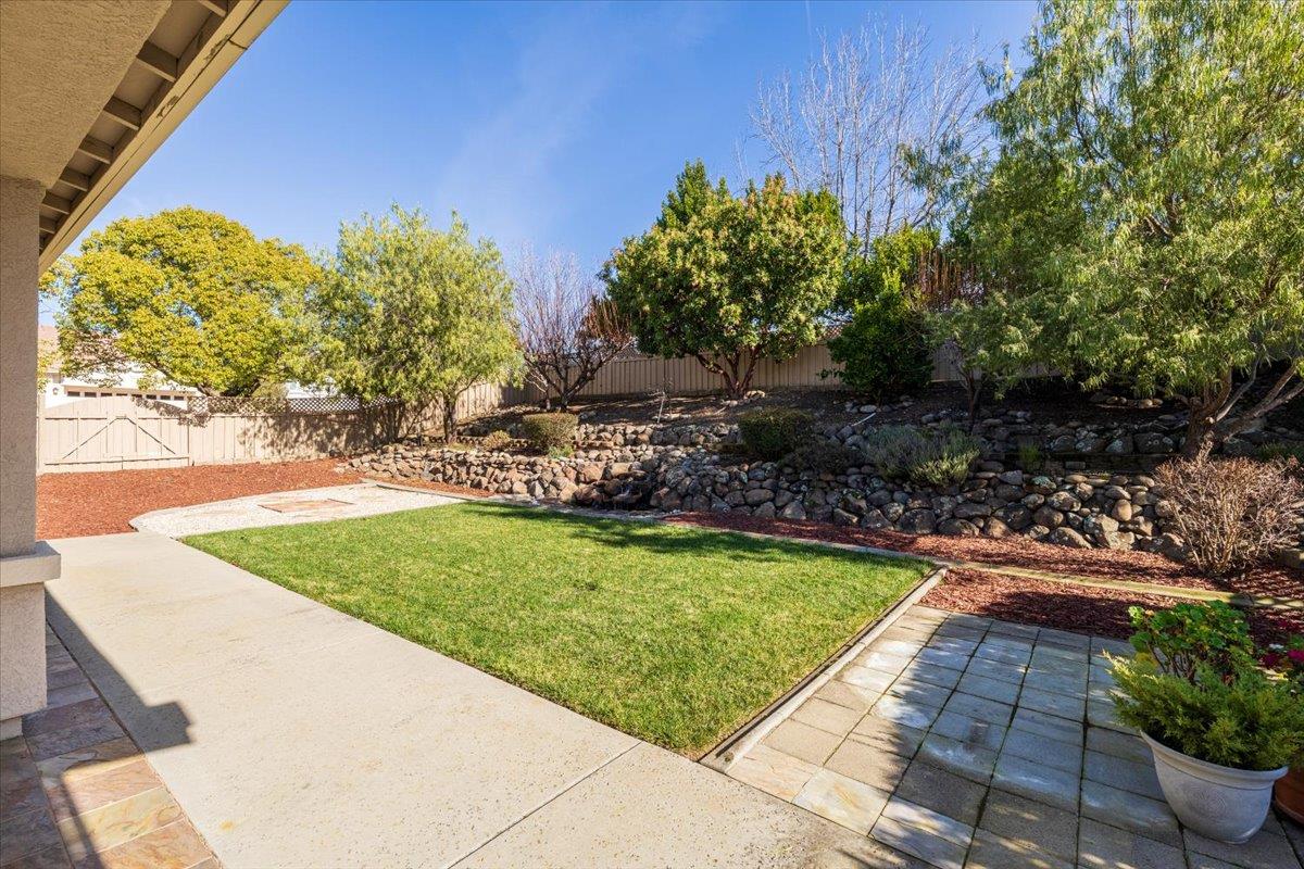 851 Rocky Ridge Lane Lincoln, CA 95648 - Photo 27 of 31 a view of a backyard with plants and a patio